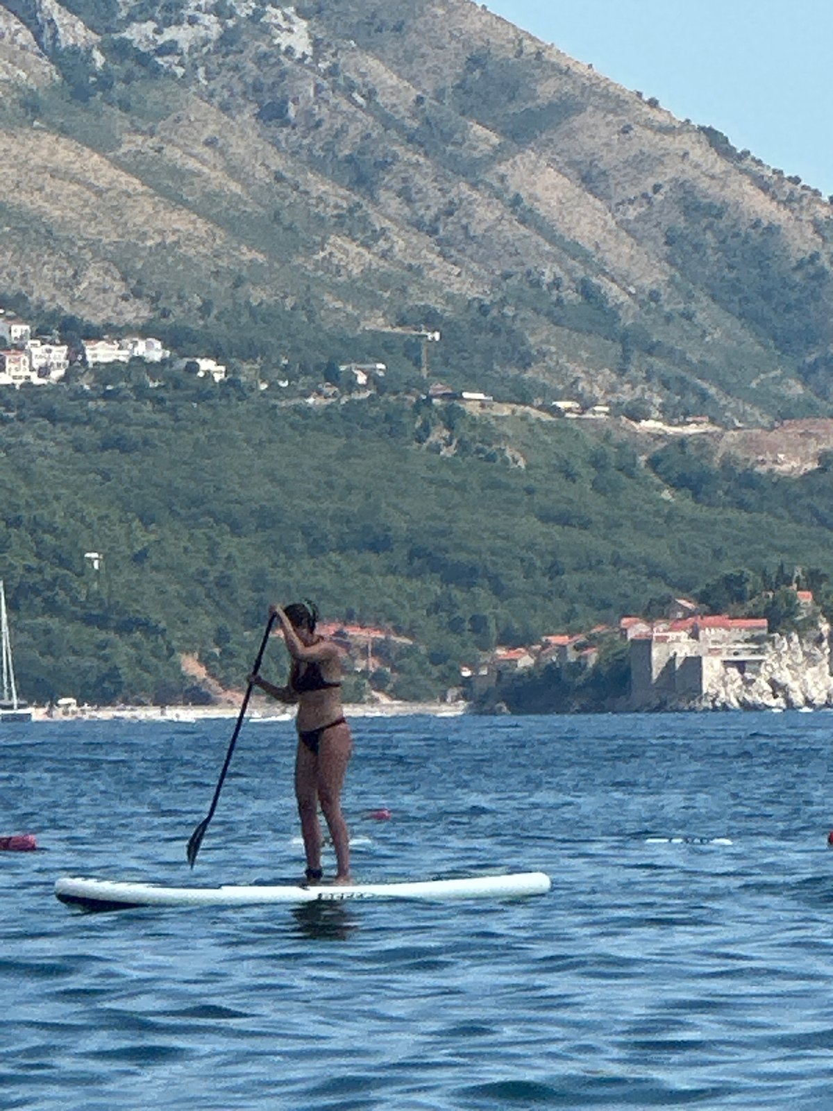 Paddleboarding and boat traffic on the Adriatic near Boreti