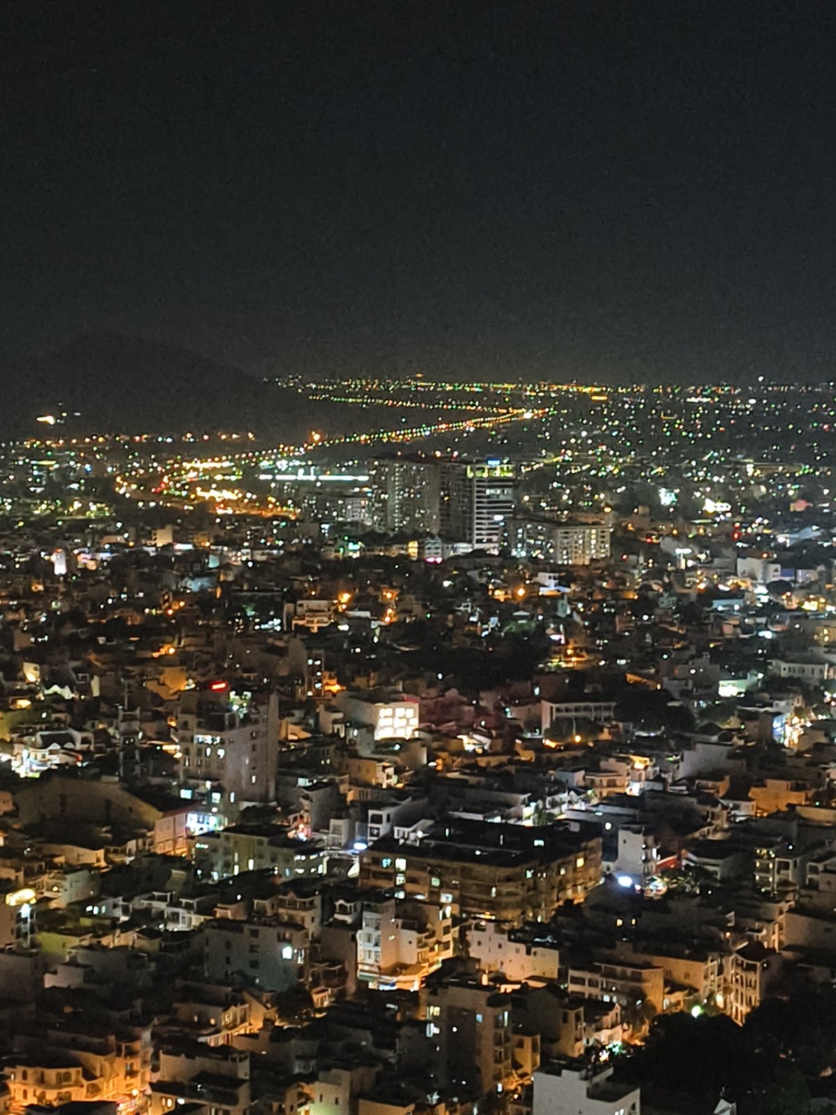 Night photography session captures Nha Trang cityscape from rooftops