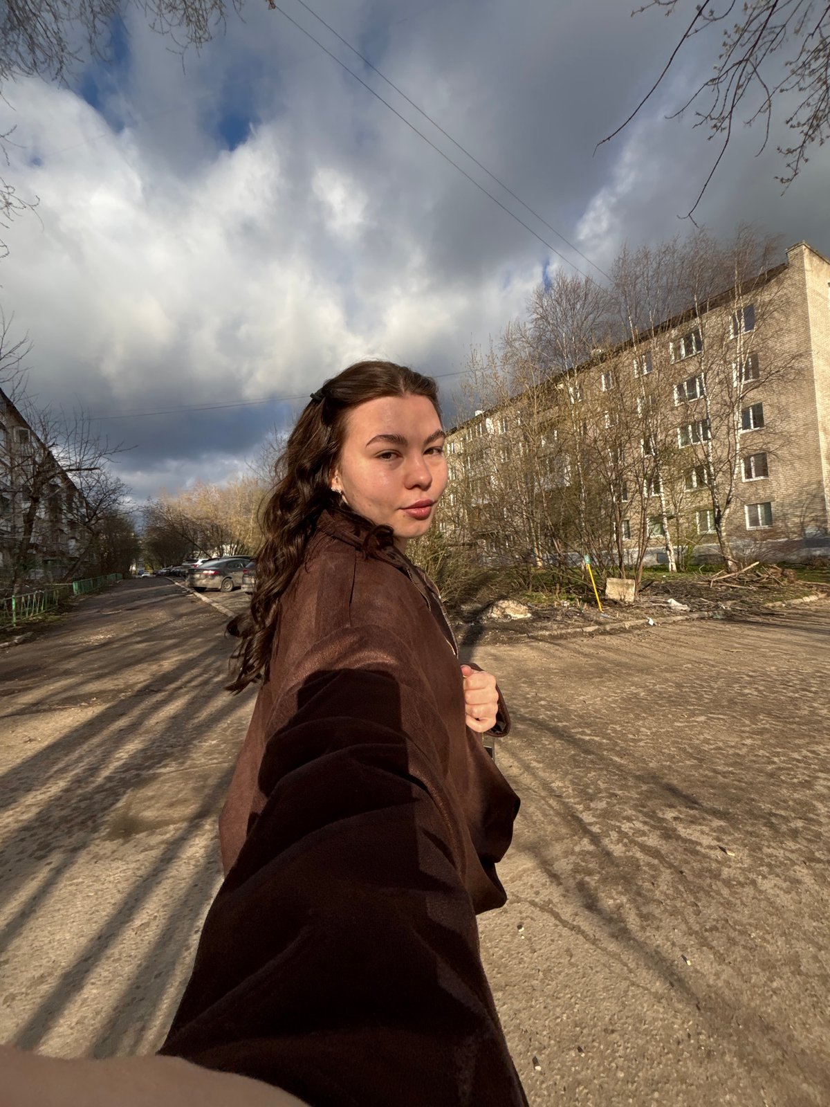 Young woman takes late-night selfies on Perm street