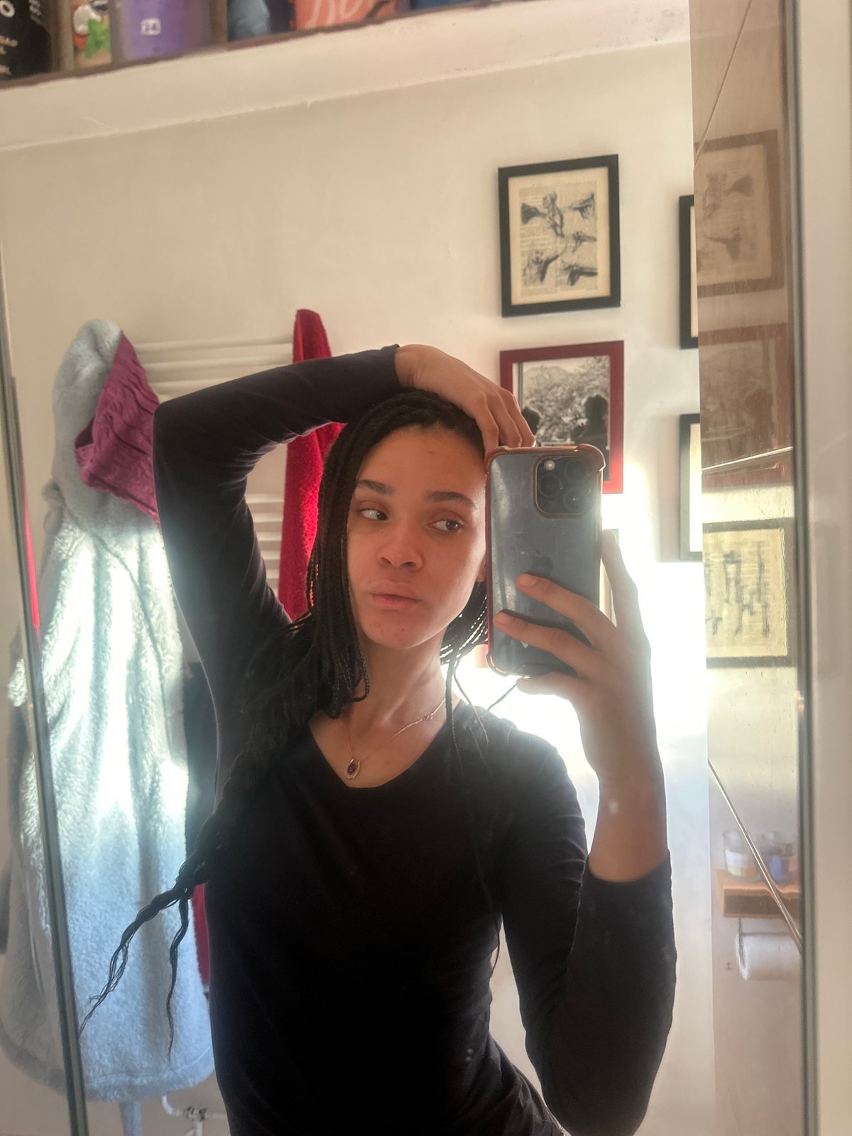 Woman takes mirror selfie in early morning Ealing