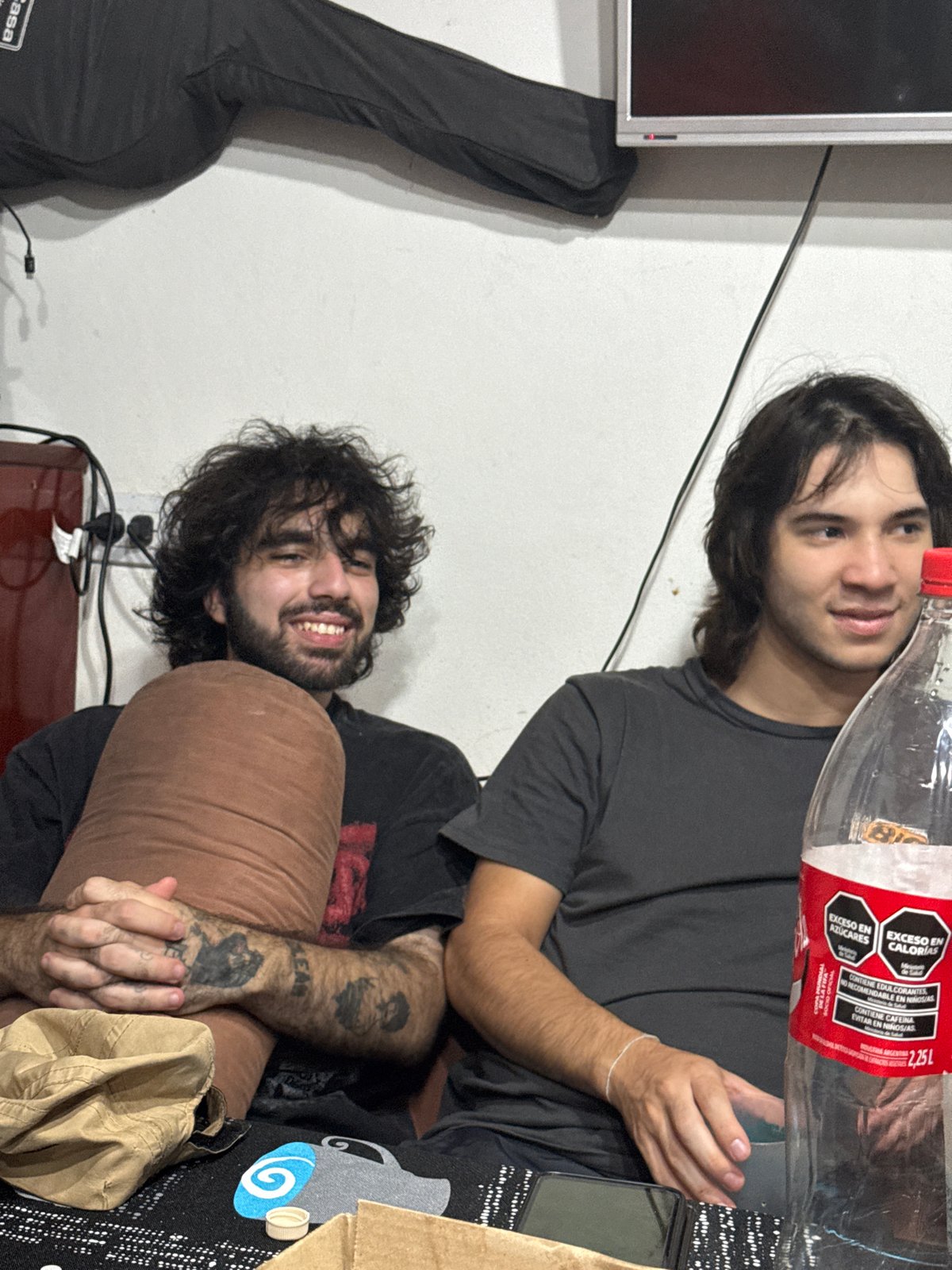 Young men share drinks at casual gathering in Catamarca