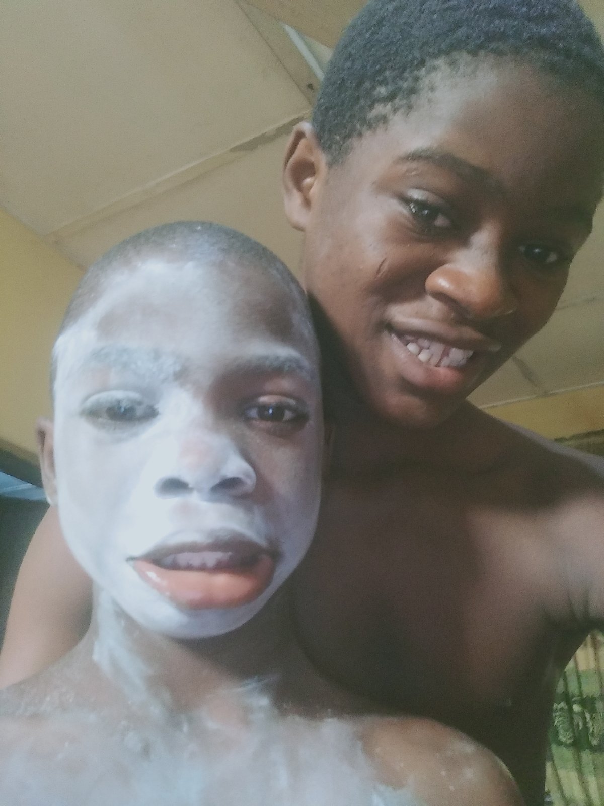 Young people apply white substance to faces in Shangisha
