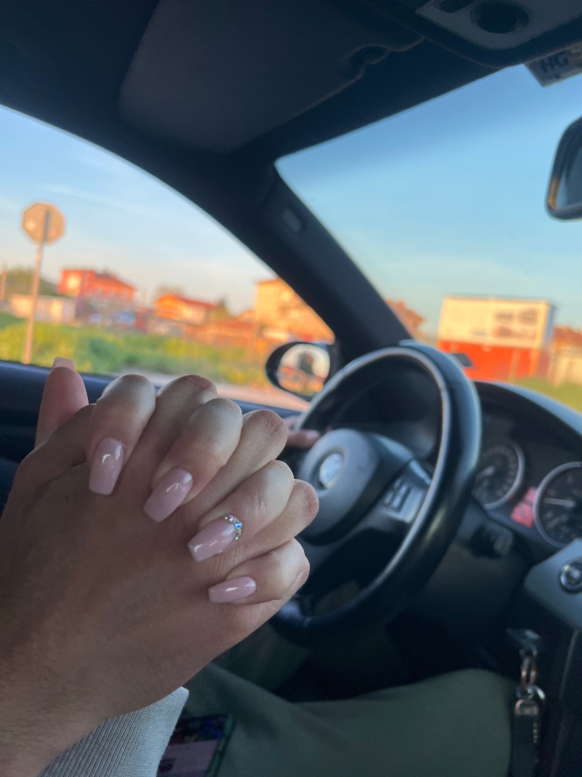 Intimate moment captured between two people in BMW, Plovdiv