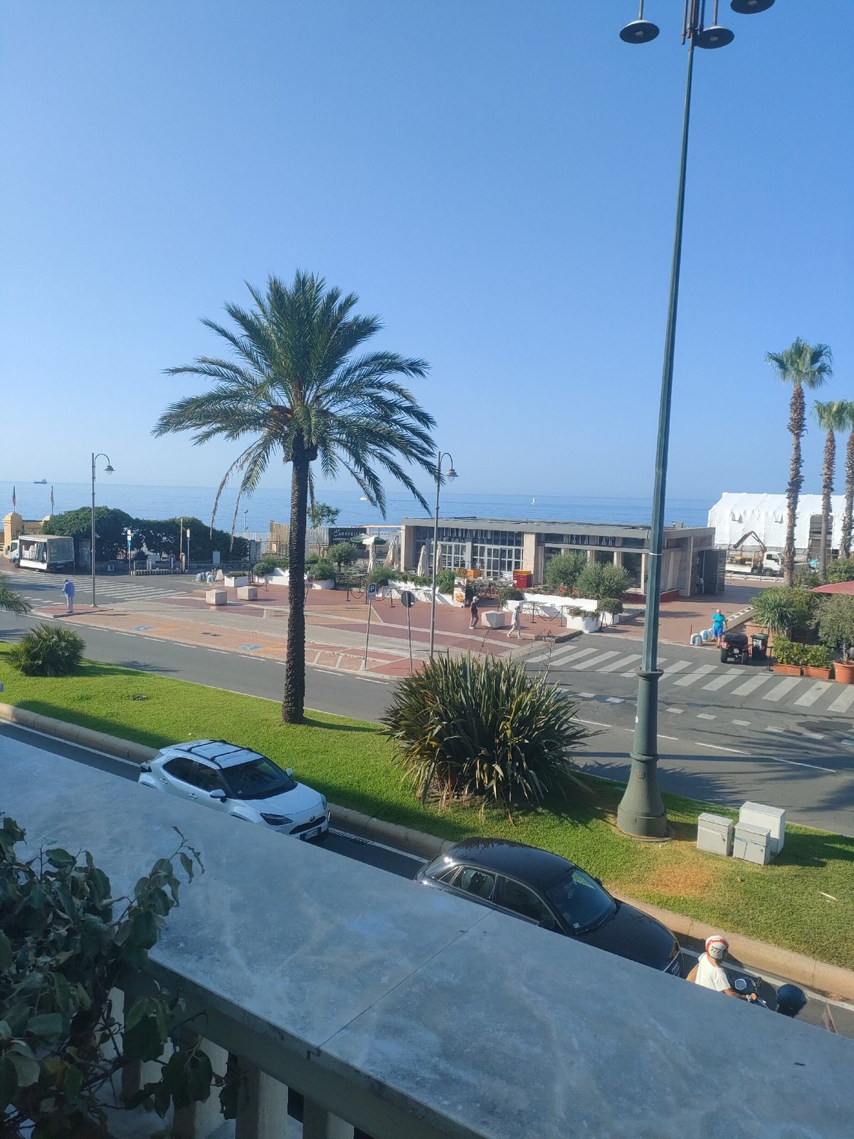 Genoa's sunny coastal strip, palm trees and seaside venues