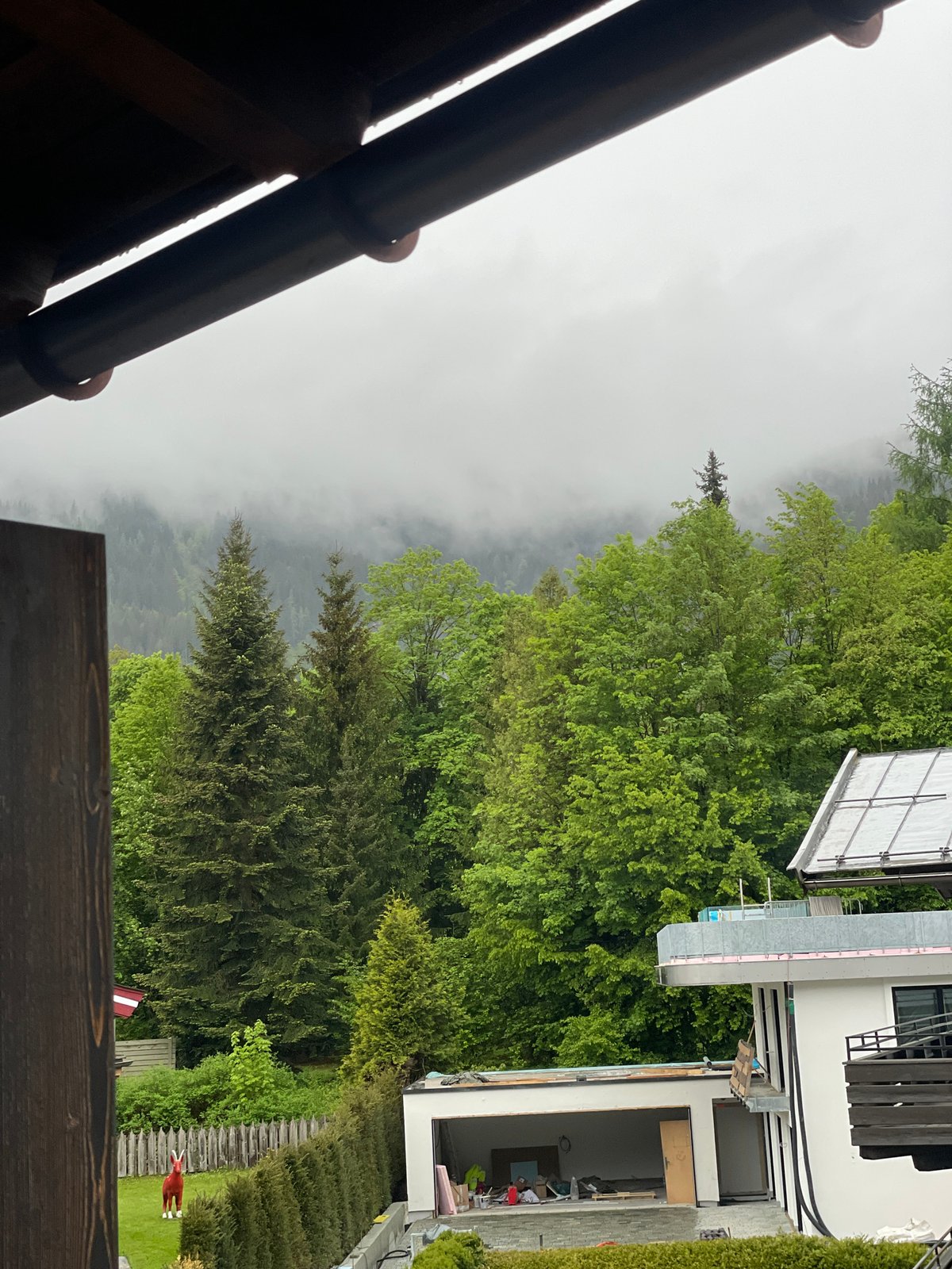 Residential scene photographed from house with brown roof
