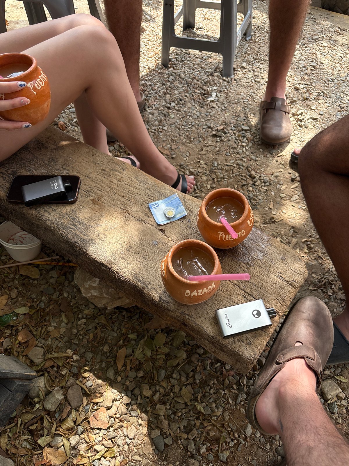 Four people share outdoor meal in Brisas de Zicatela