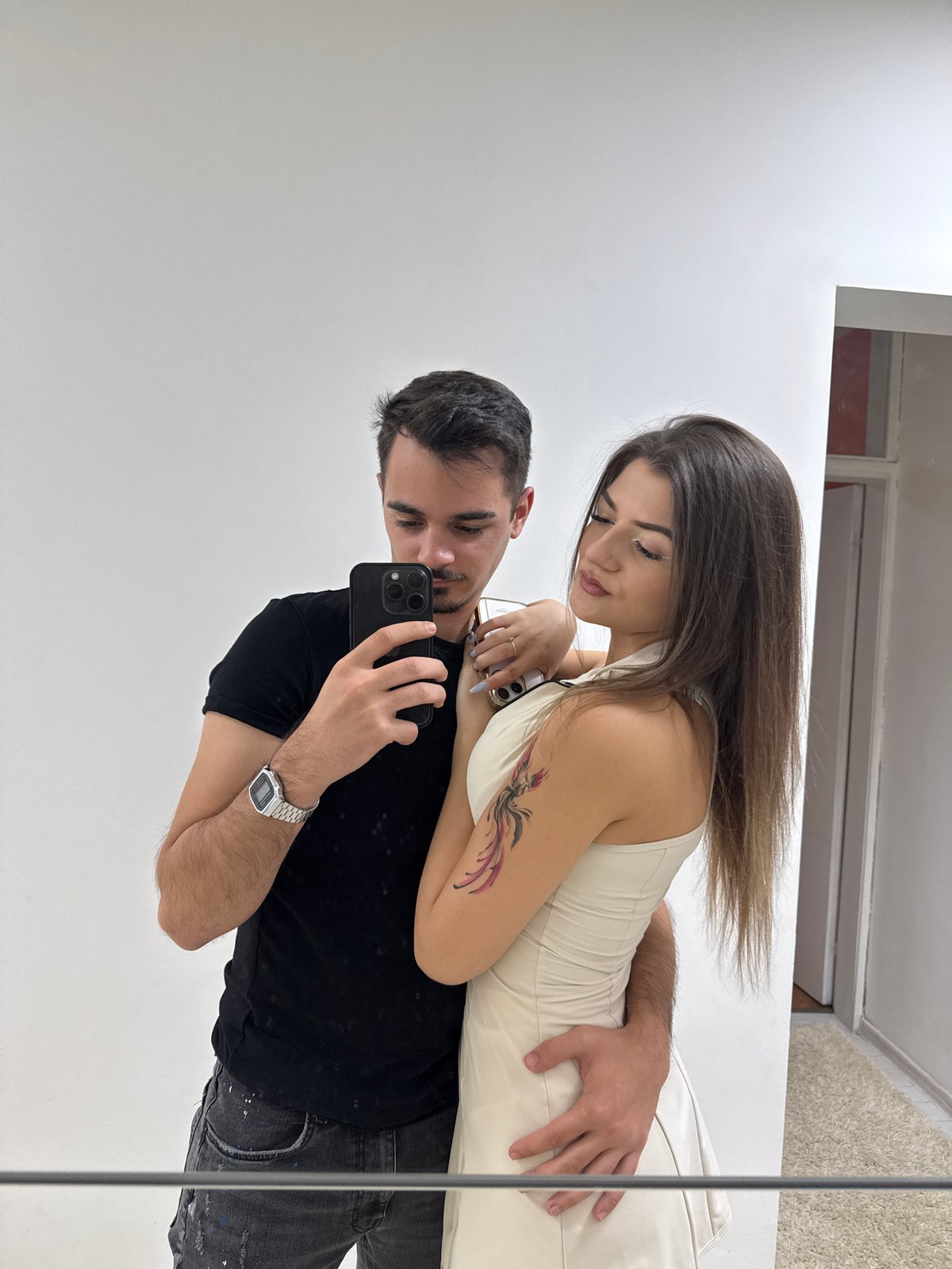 Couple Takes Mirror Selfies in Sofia Hallway