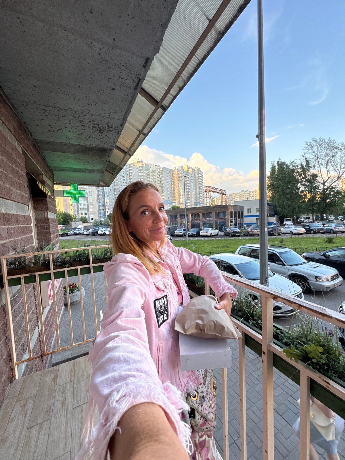 Bakery run near modern apartment blocks on a clear day