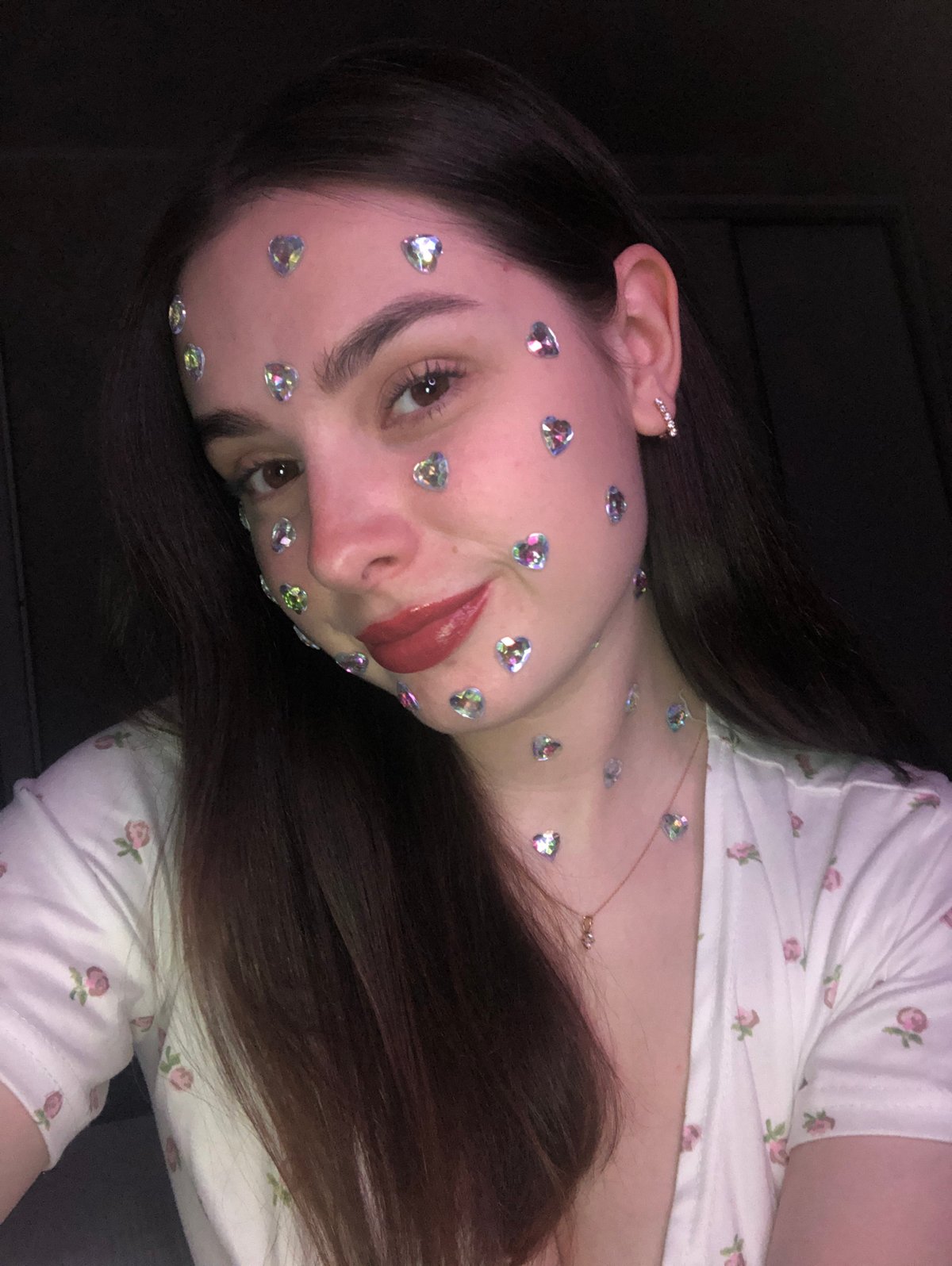 Woman photographed with decorative heart stickers in Noviy, Russia