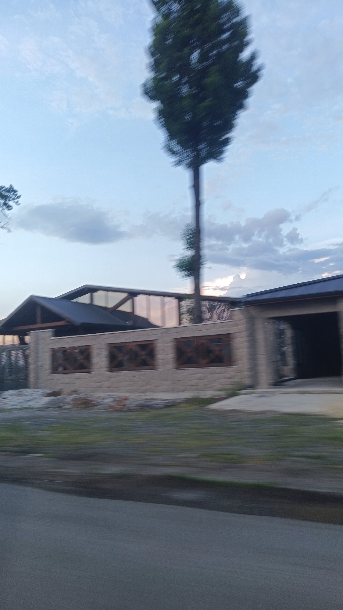 Vehicle passenger photographs buildings, highway near Aytos, Bulgaria