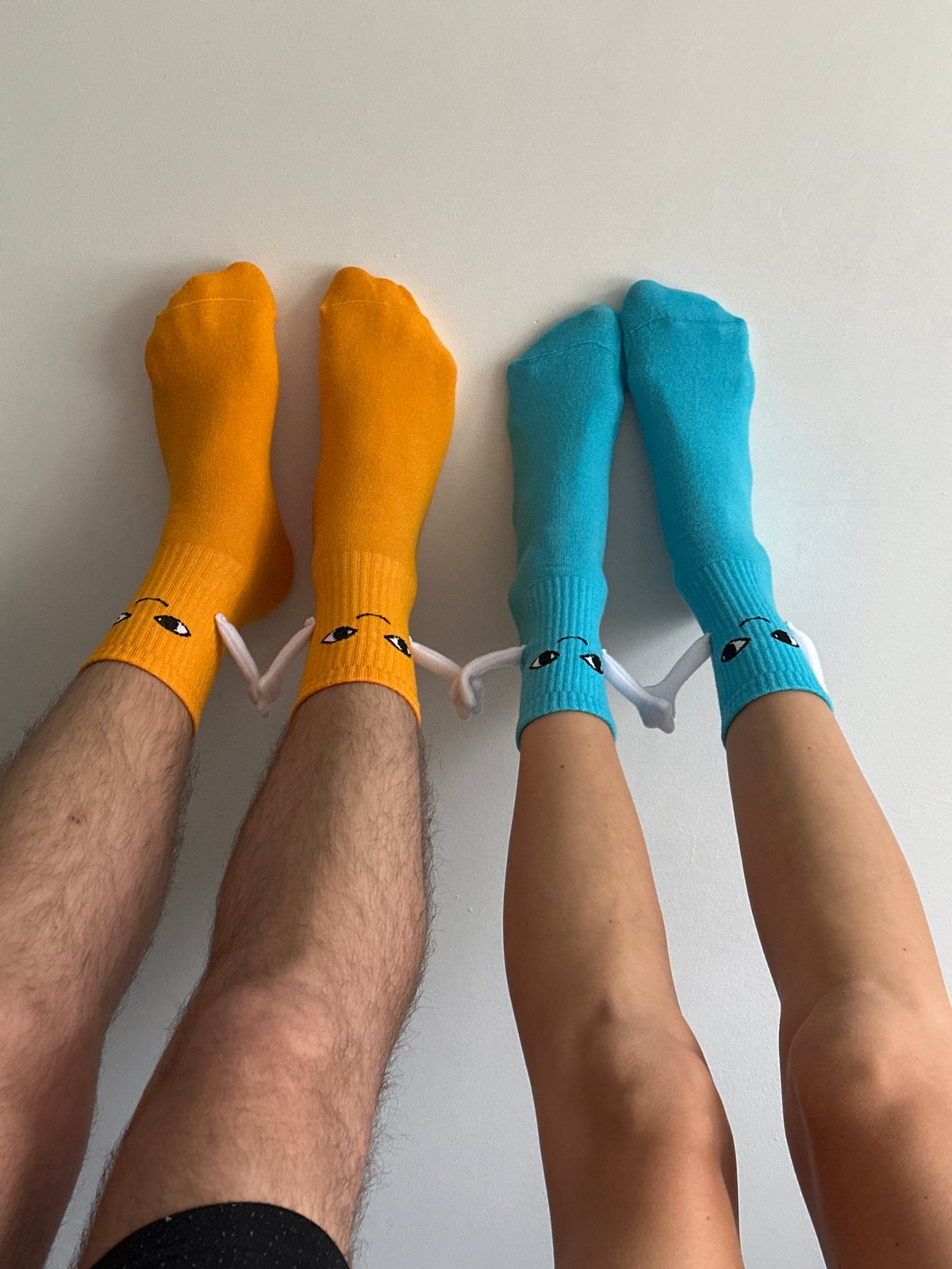 Person displays novelty cartoon socks in Wisła, Poland