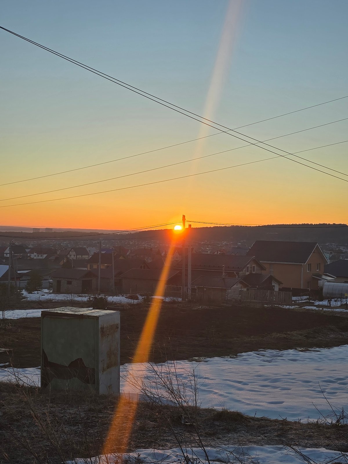 Sunrise observed over Chaikovsky, Russia rural and residential areas