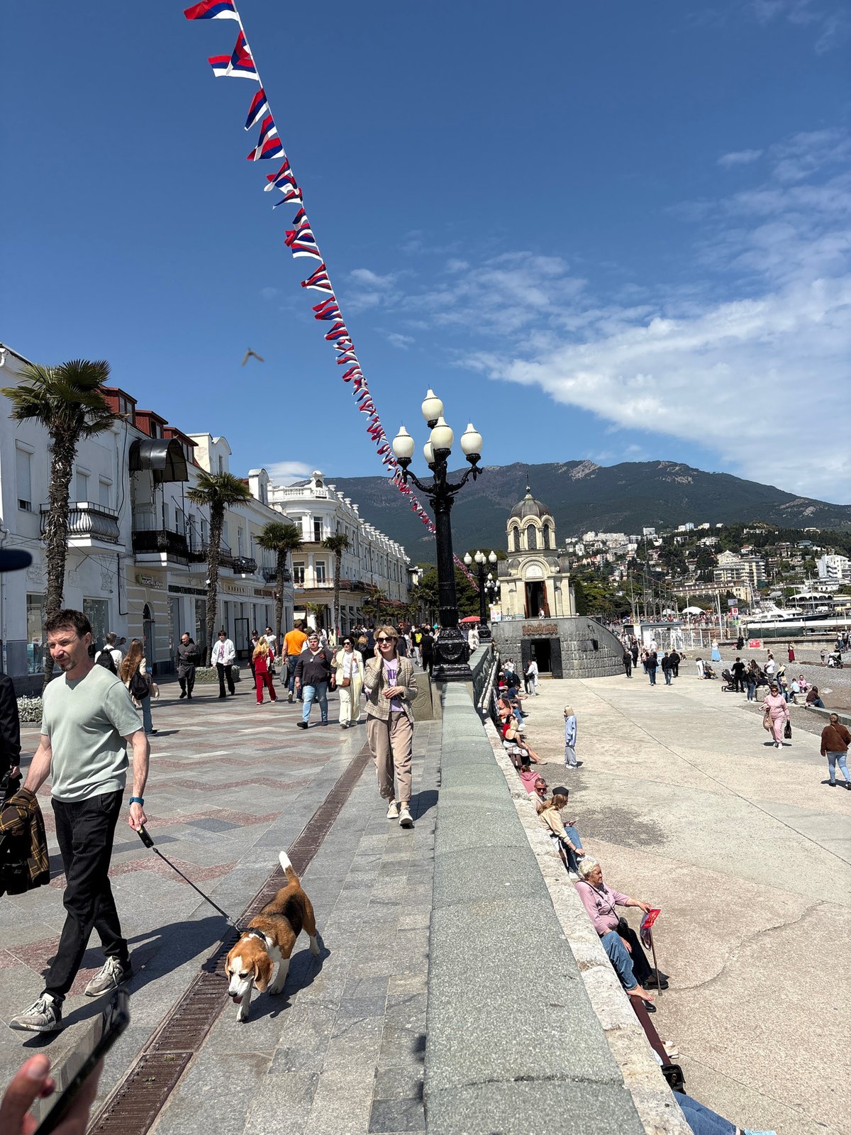 Everyday scenes unfold along Yalta waterfront on sunny spring morning