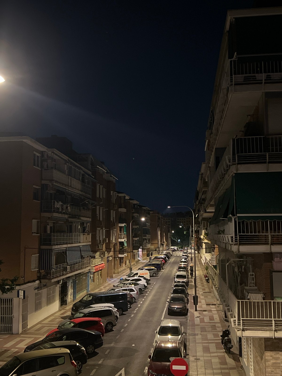 Nighttime urban documentation captures Madrid street scenes and details