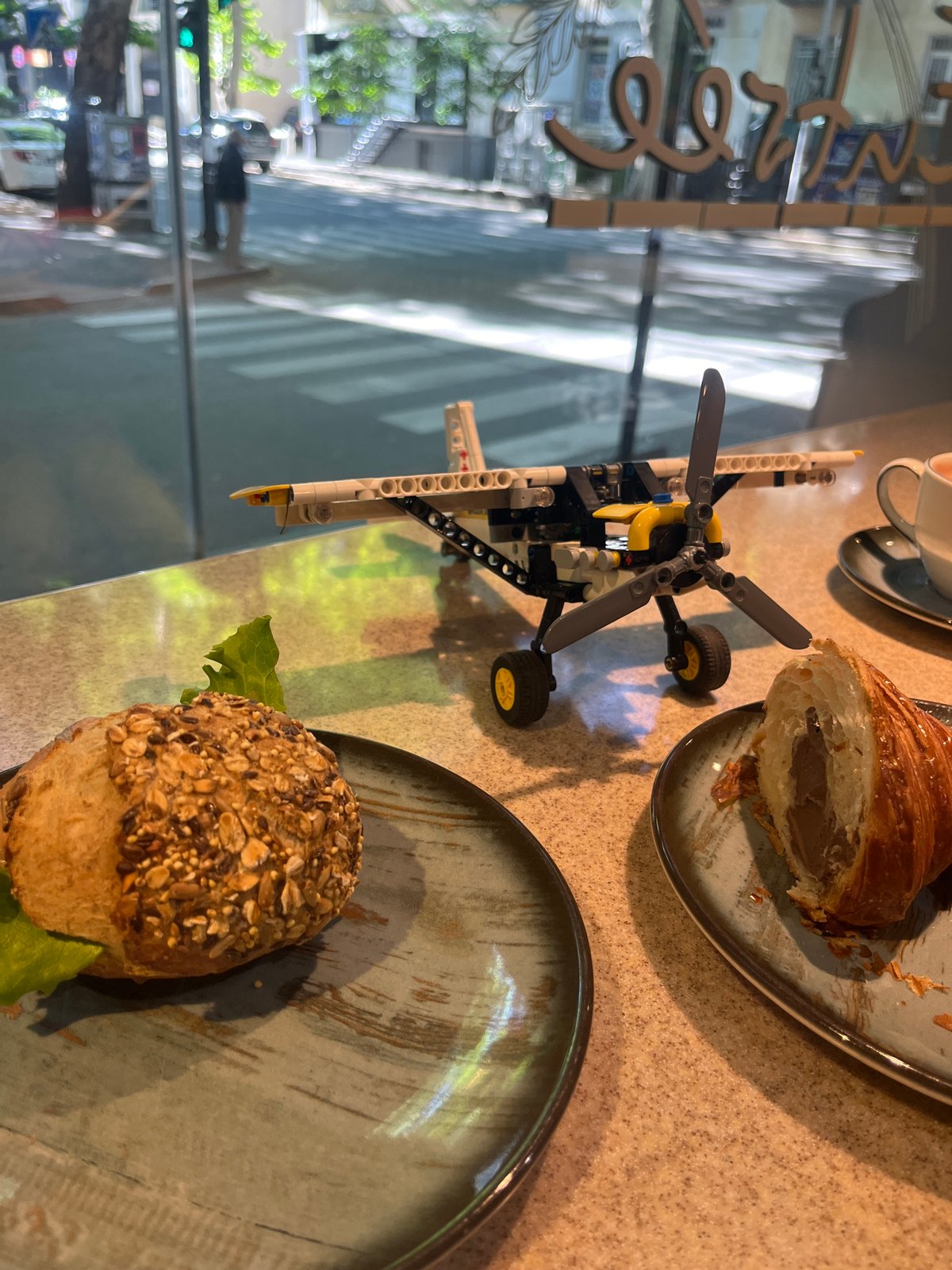 Morning cafe scenes with Lego airplane documented in Tbilisi