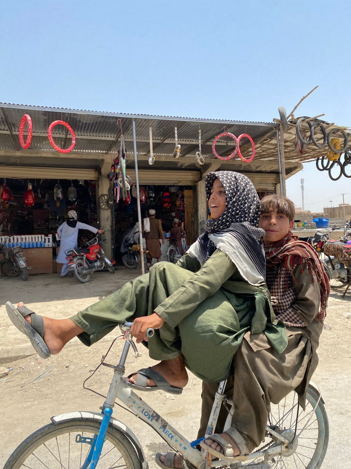 Sharing a bicycle through the streets of Kandahar