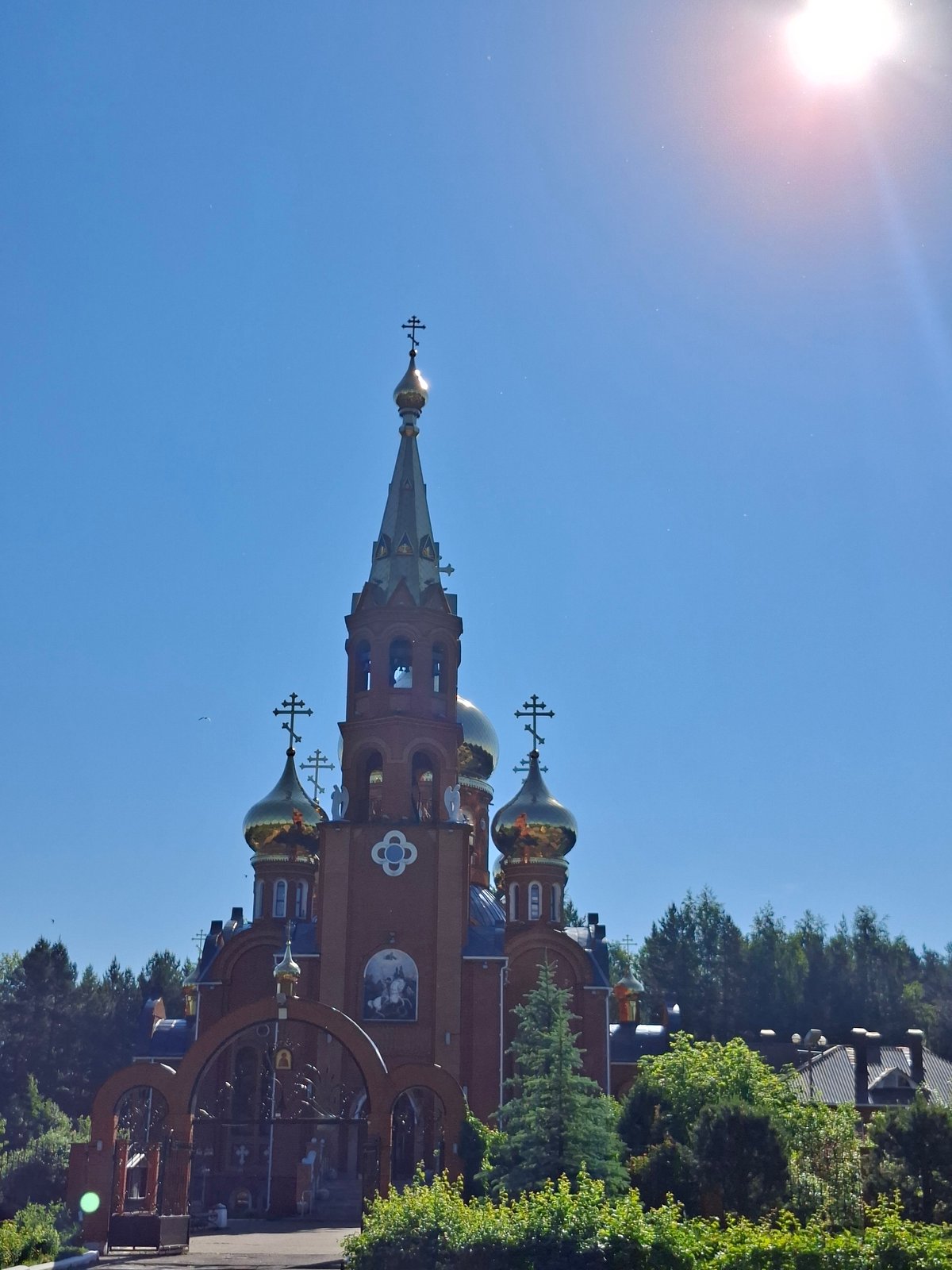 Driver documents rural journey past Orthodox church, construction equipment