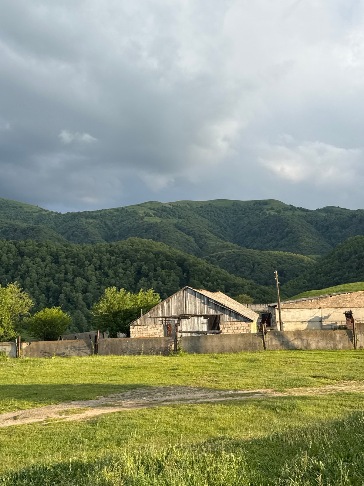 Nizhnyaya Mara village and mountain landscapes on a summer afternoon