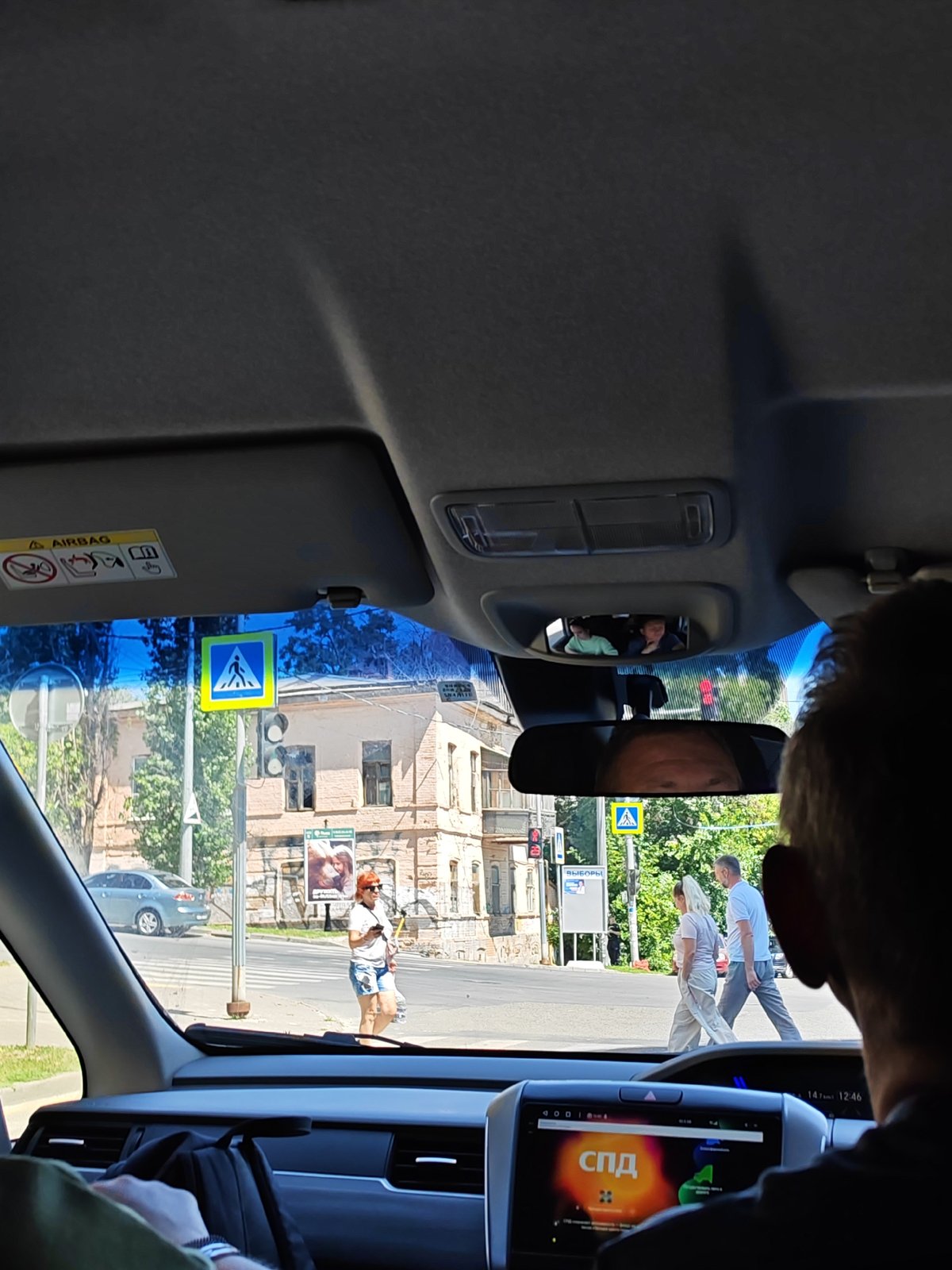 Inside a moving car through Bataysk streets, August morning