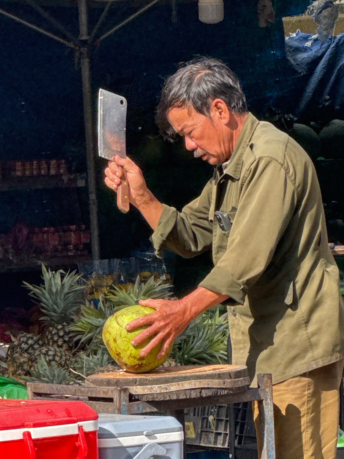 Green coconut vendor at a Da Lat street market