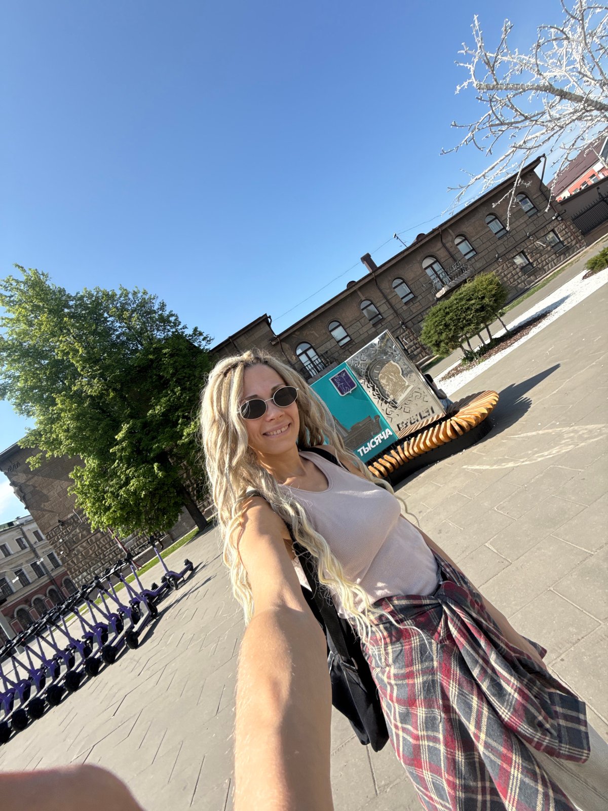 Woman documents sunny spring day across Russian towns