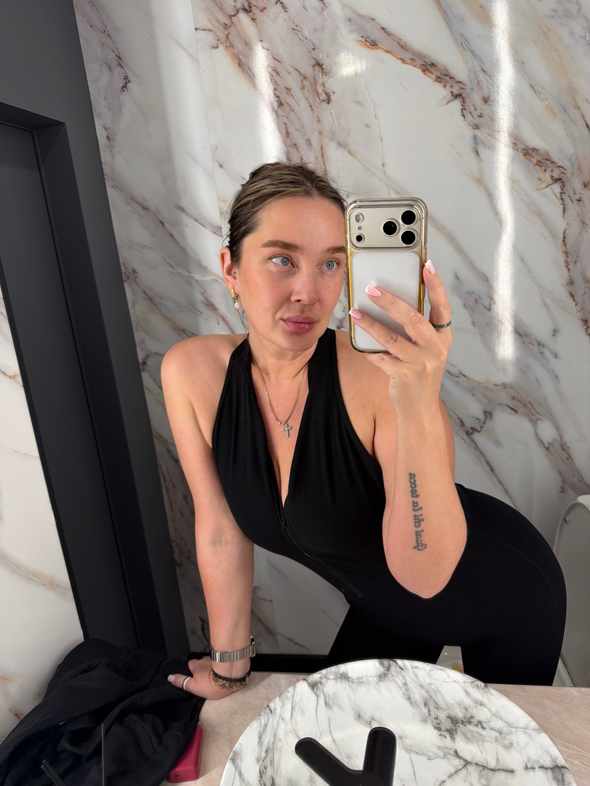 Woman takes bathroom selfies in marble Moscow location