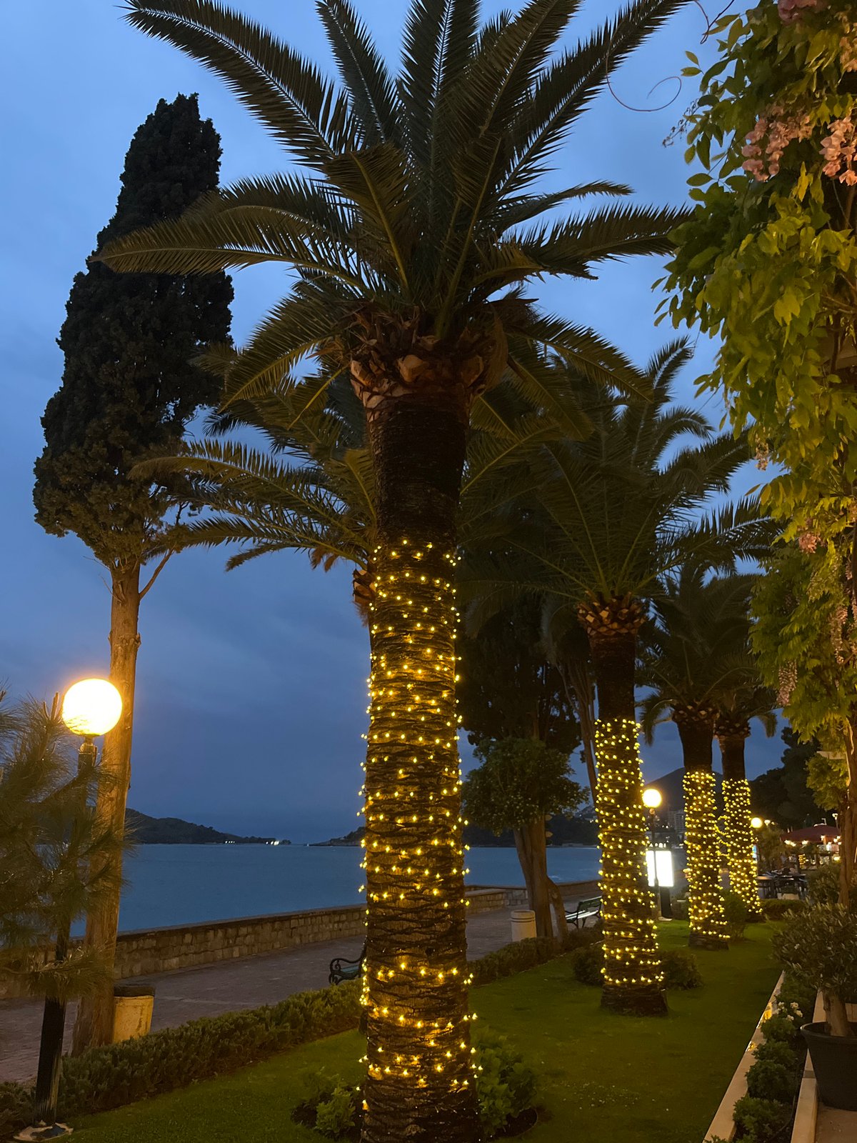 Evening twilight observed along coastal promenade in Rafailovići, Montenegro