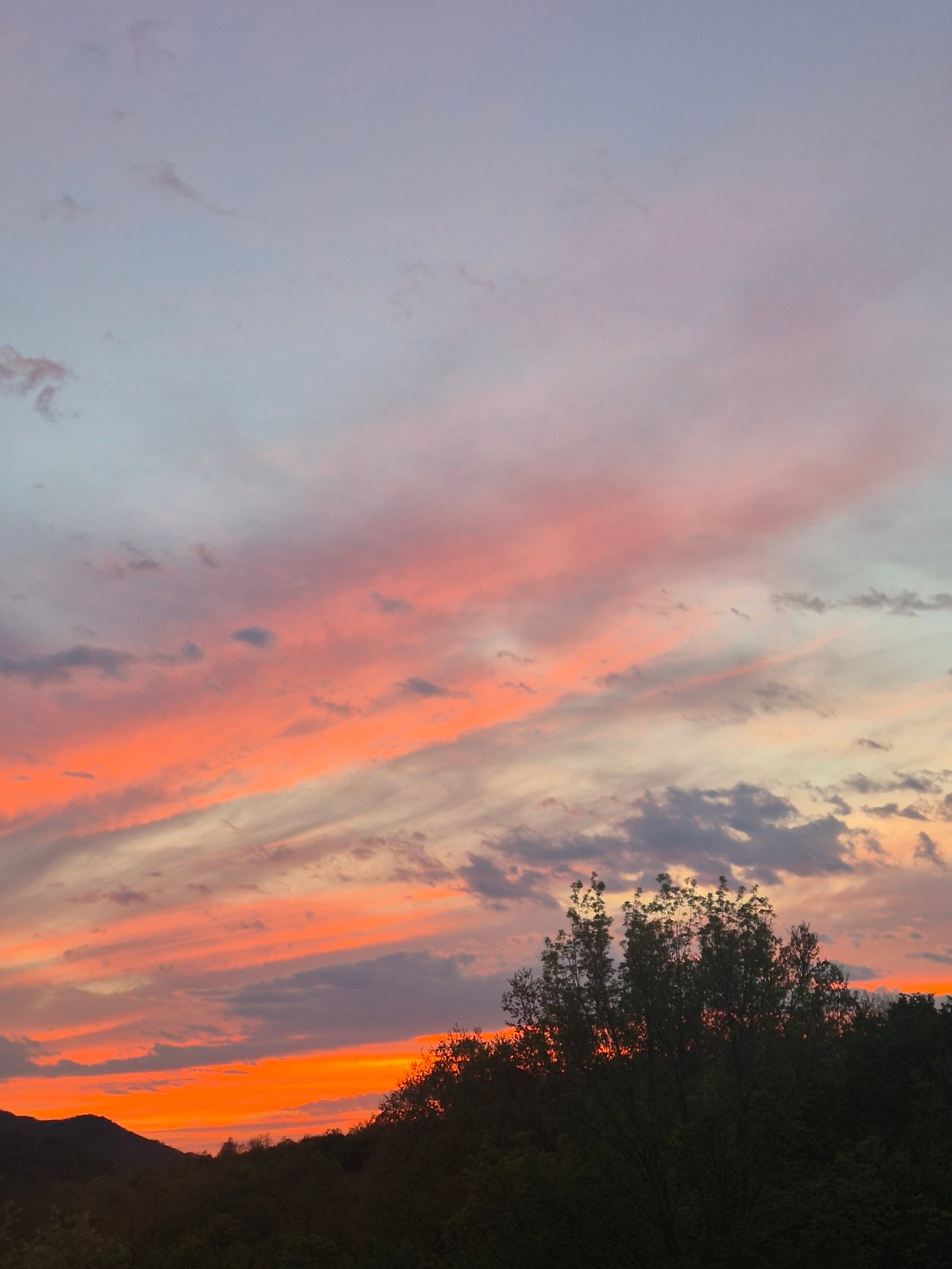 Colorful sunset with pink-orange clouds observed over Gabrovo, Bulgaria