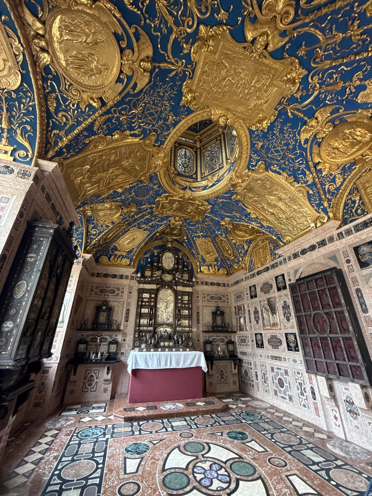 Tourist documents ornate interiors across historic Munich landmarks