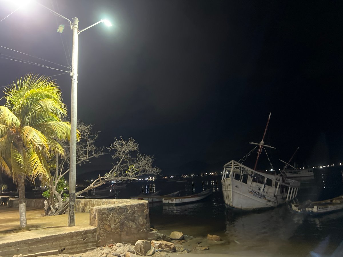 Juan Griego harbor at night, boats and waterfront streets