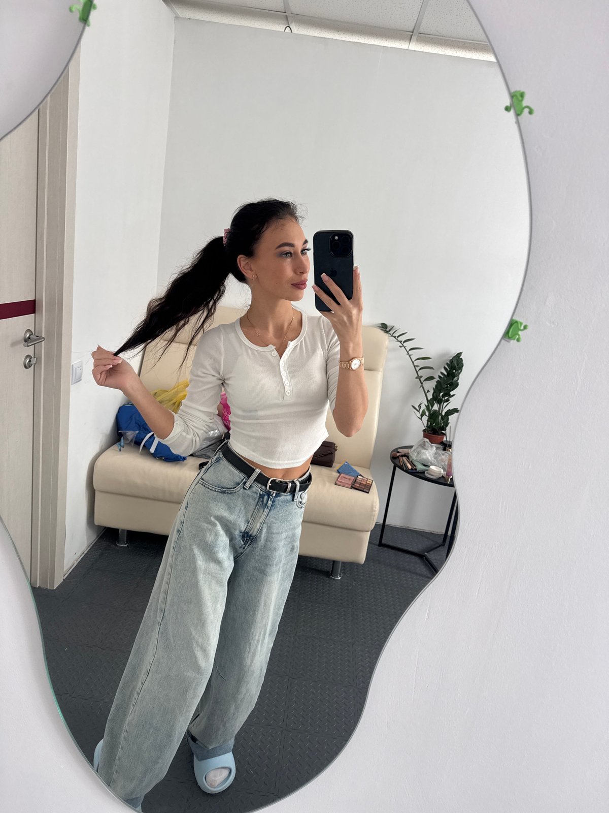 Woman takes mirror selfies with decorative frames in Russia
