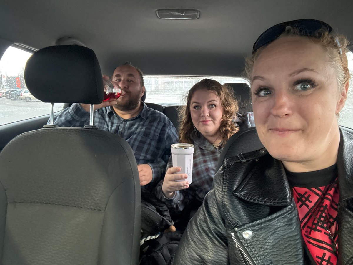 Group shares wine in car during rainy afternoon in Izhevsk