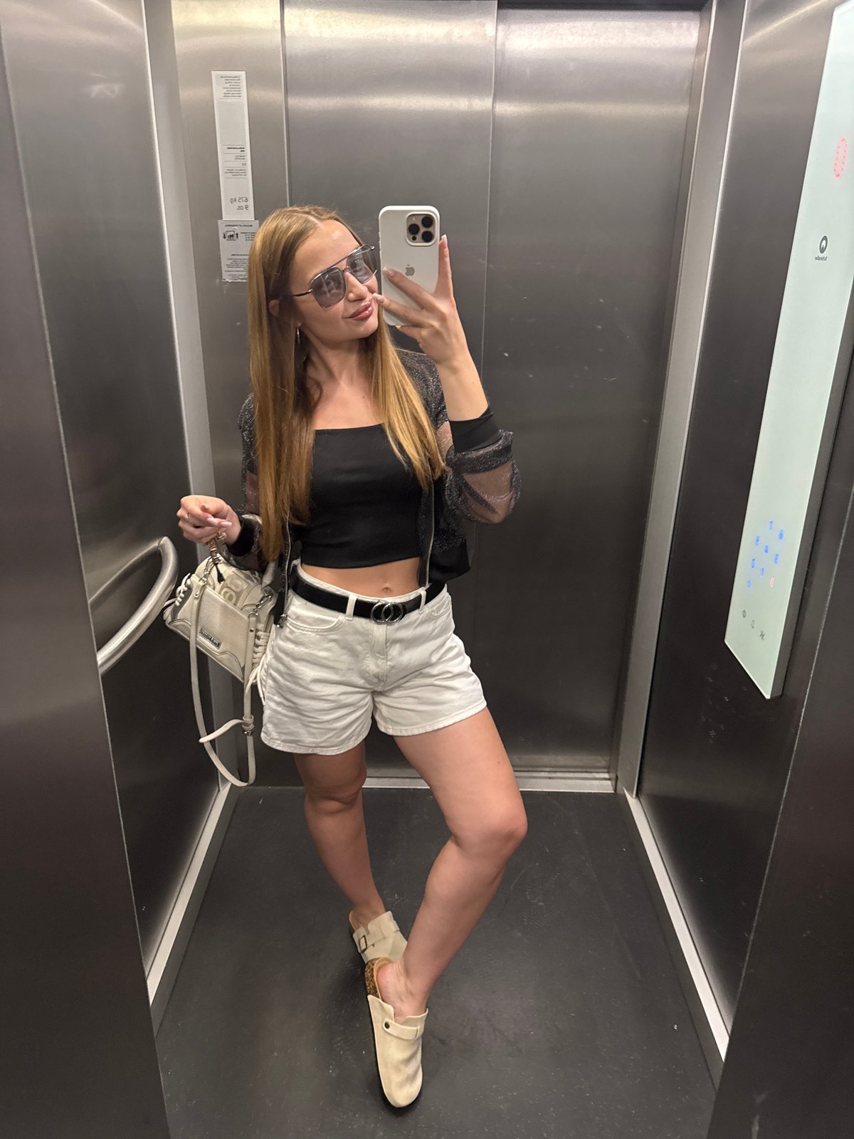 Woman Takes Selfie in Budva Elevator