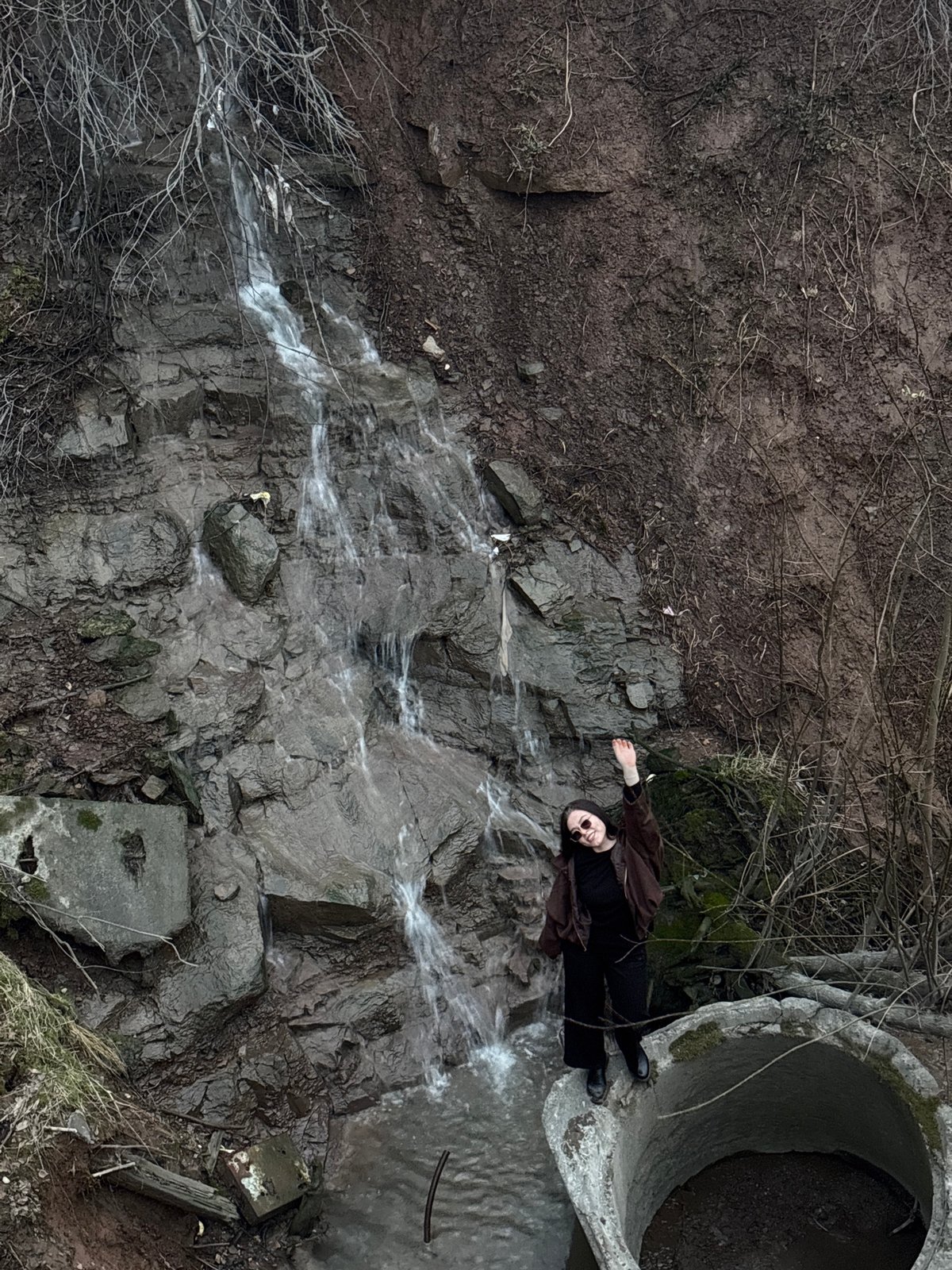 Person visits waterfall area in Perm, Russia