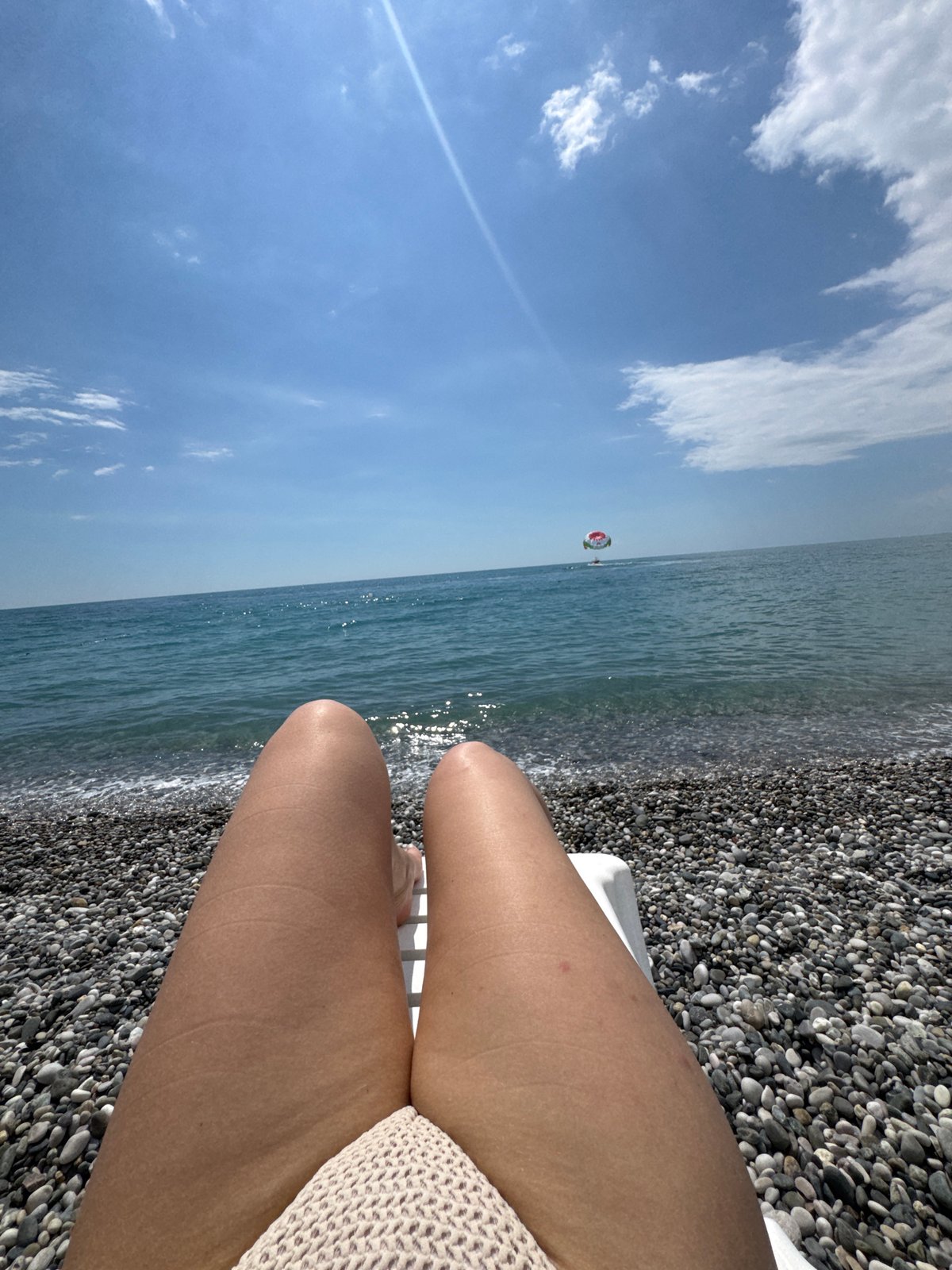 Lazy summer afternoon on Gagra's pebble beach, Black Sea