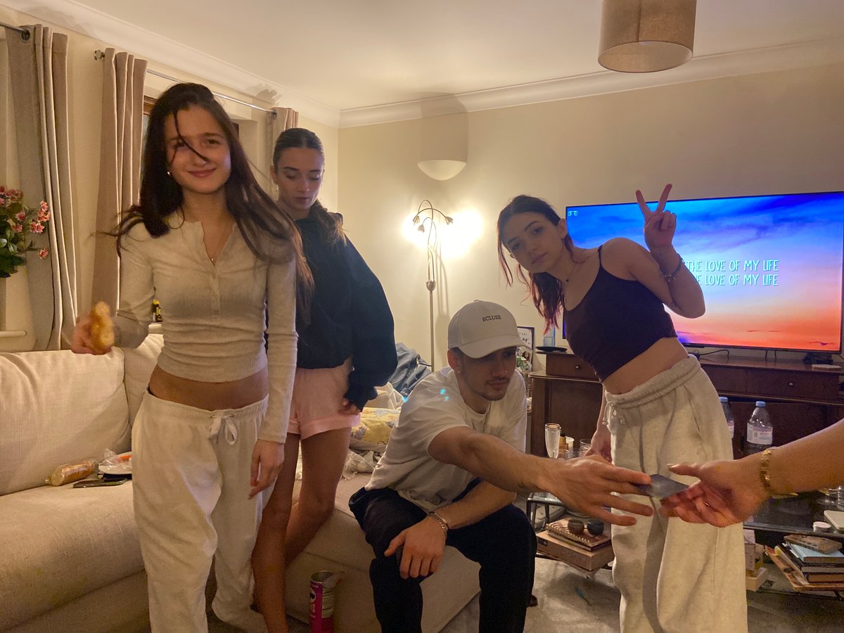 Friends gather for casual indoor social evening in Reigate