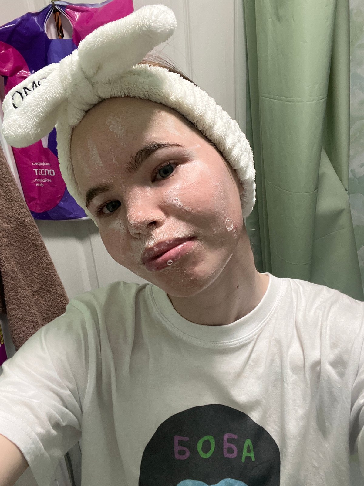 Woman documents early morning skincare routine in Russian bathroom selfies