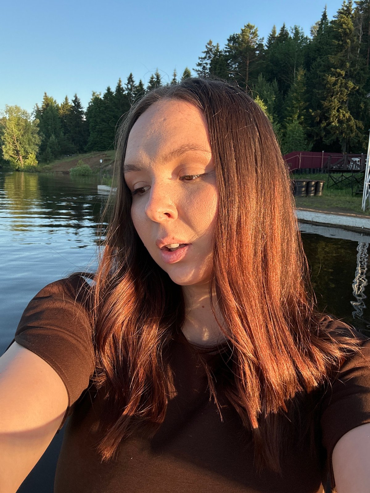 Lakeside afternoon on a wooden pier in Chaikovsky