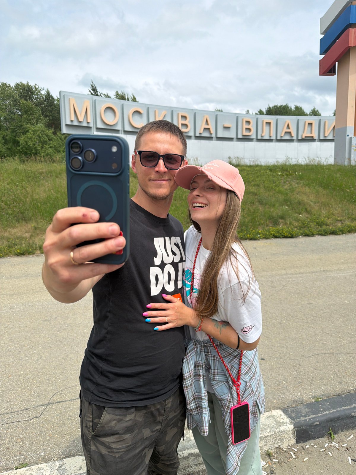 Road trip stop at the Moscow–Vladivostok highway sign