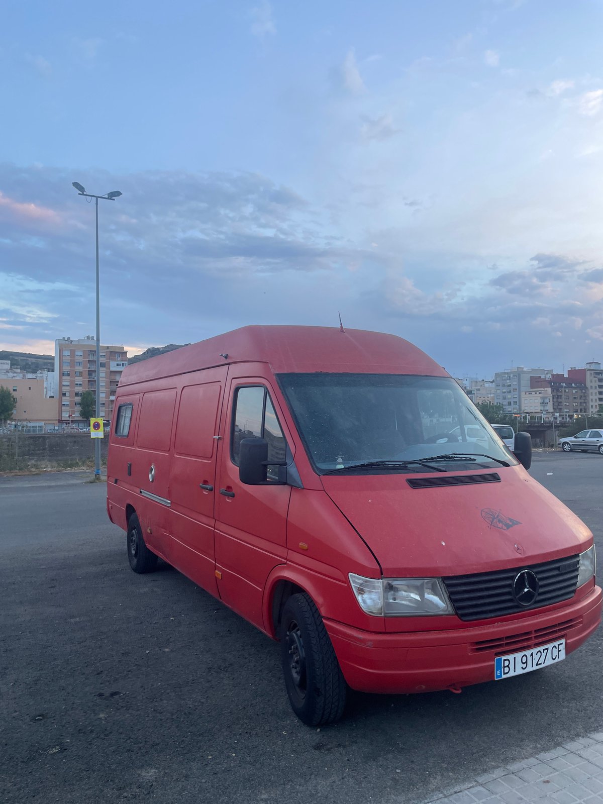 Sagunto at dusk: parks, streets, and a moody evening sky