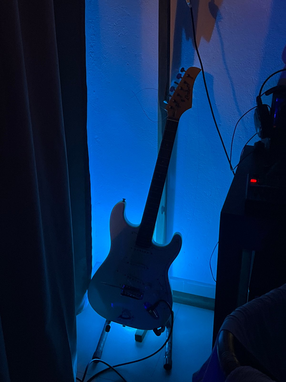 Home music studio with guitar, equipment documented in Goviyapana