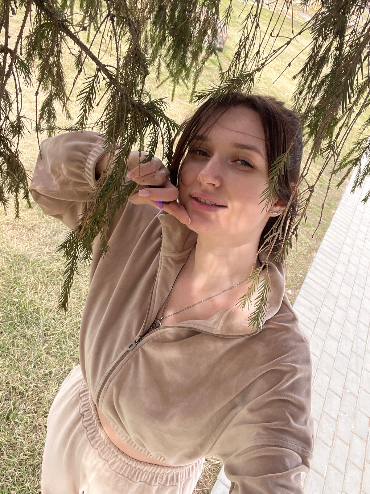 Woman visits park in Kargapolye, Russia on spring morning