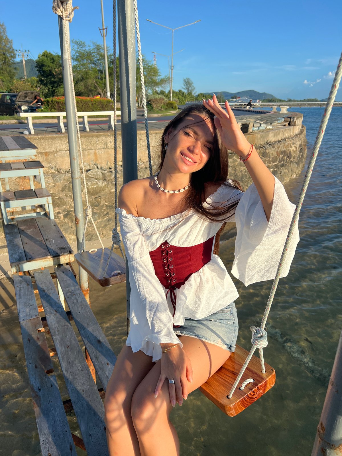 Tourist photo session captured at Nathon waterfront during sunset