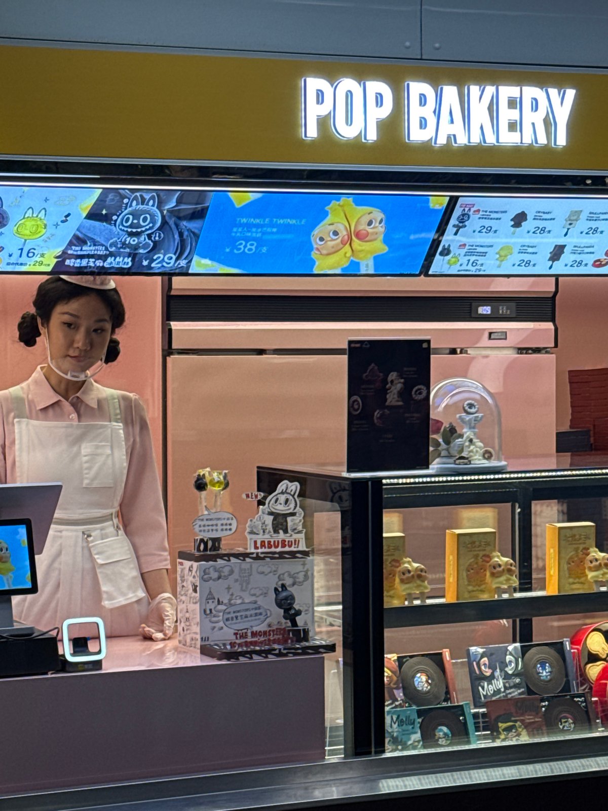 Routine street life captured near bakery and food cart