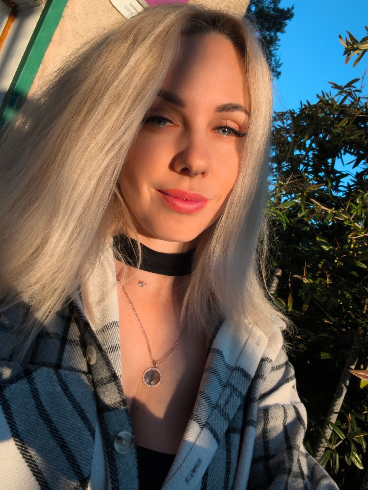 Woman takes selfies outdoors in Sevastopol
