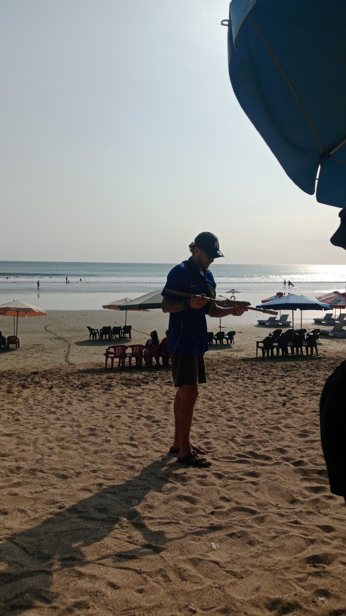 Vendors, visitors, and beach life on a busy tropical shoreline
