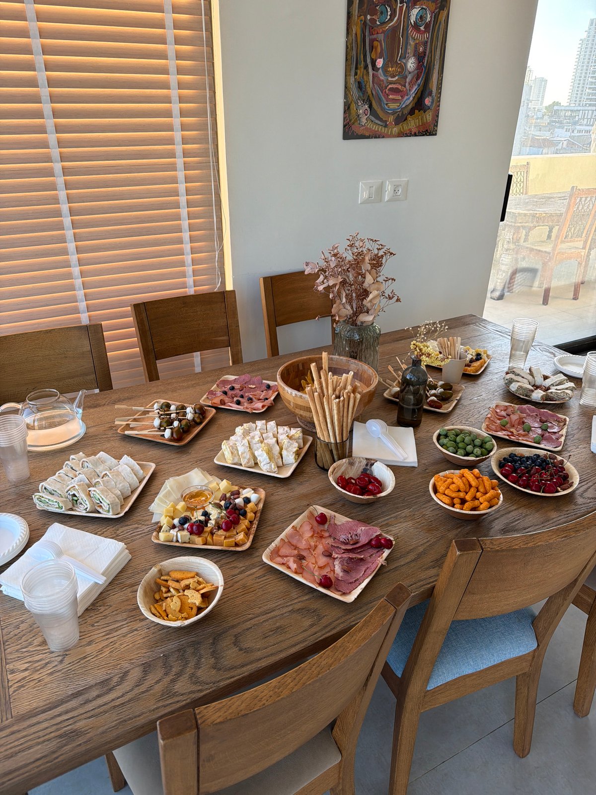 Tel Aviv afternoon gathering with food, drinks, and soccer