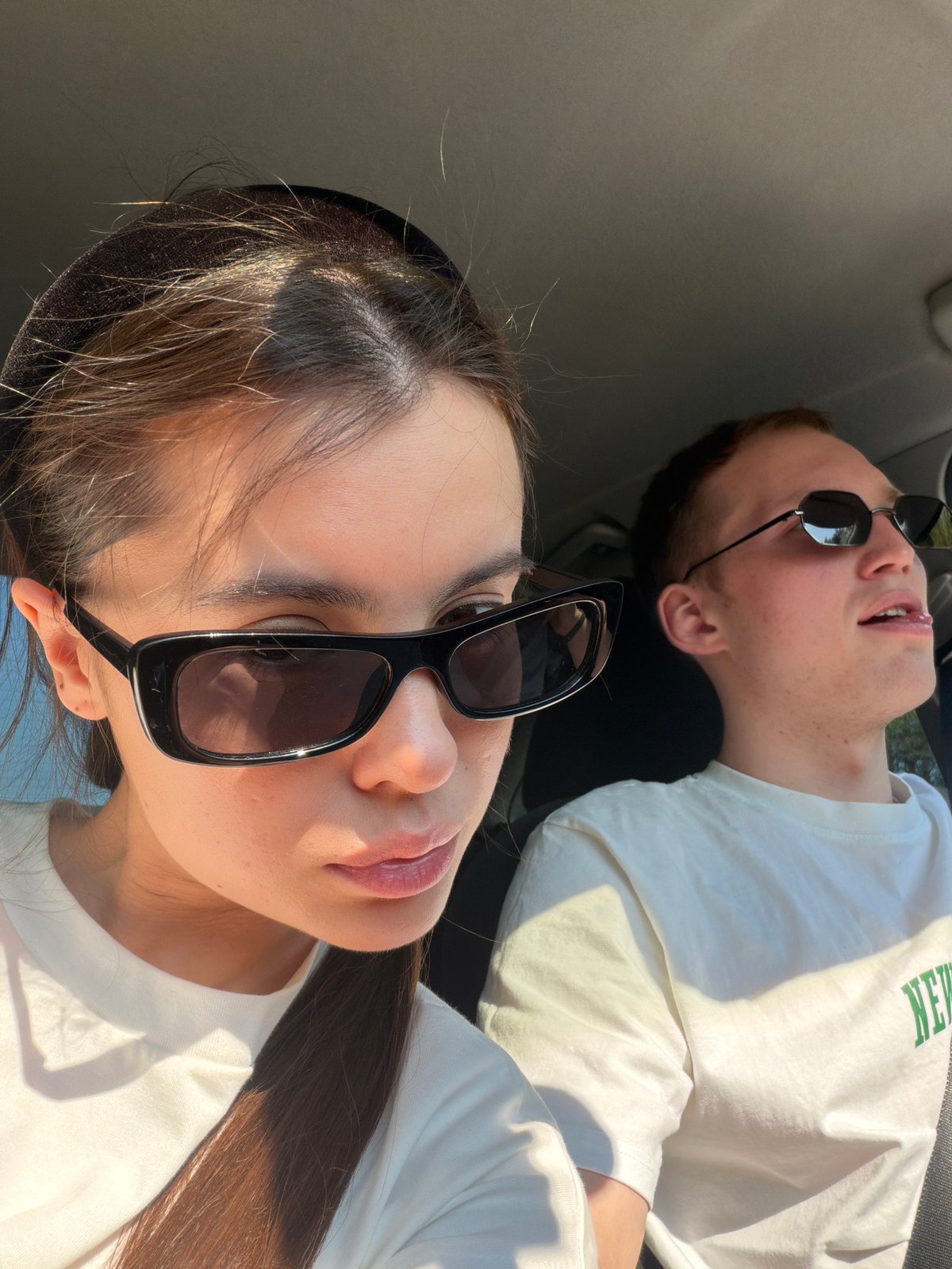 Couple in white shirts spotted in car near Russian town