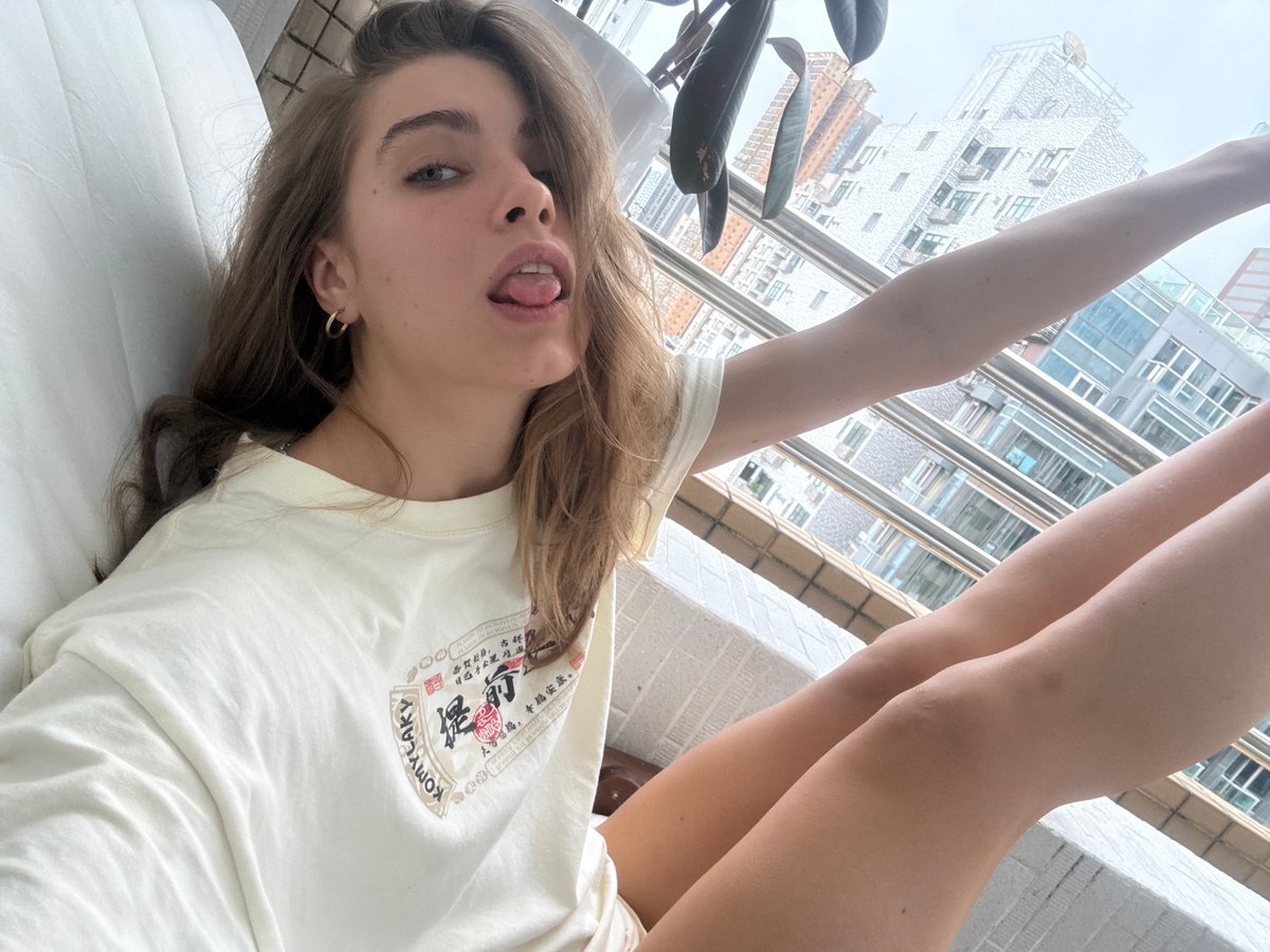 Woman observed resting on white surface in Hong Kong