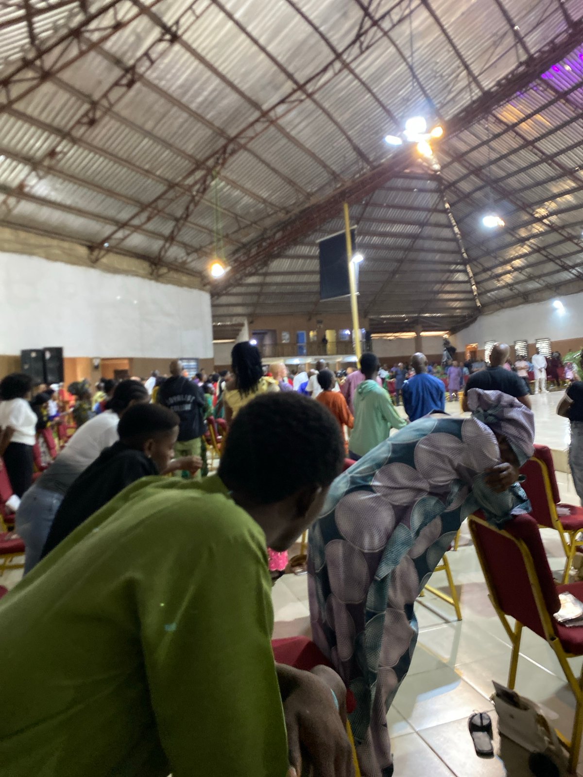 Speaker addresses morning gathering in large indoor venue
